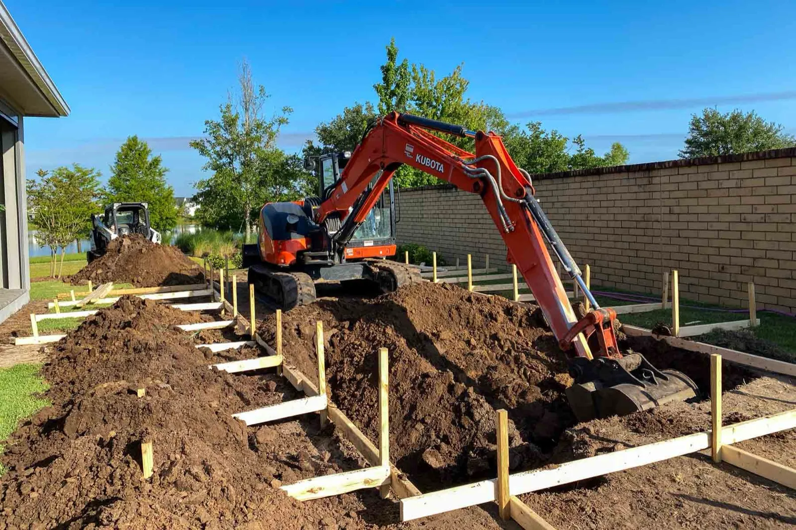 Excavator opening ground on a rural building site