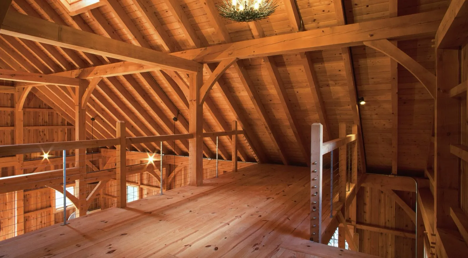 Exposed timber frame beams inside a finished build